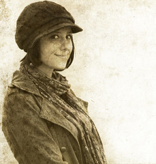 Fototapeta premium Fashion girl in cap. Photo in old image style.