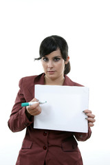 Fototapeta premium Young woman holding blank board