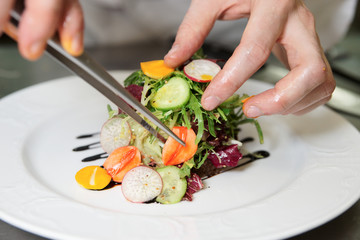 Chef is decorating appetizer