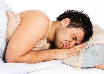 Man comfortably sleeping in his bed