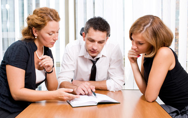 Manager with office workers on meeting