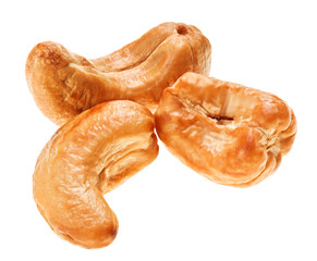 Three unshelled roasted cashew nut, isolated on white