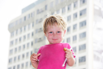 happy cute child on modern building background