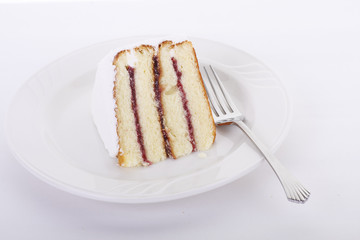 Rasberry Filled Layer Cake on White Plate
