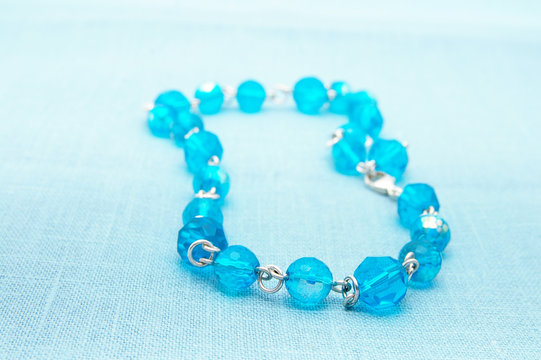 womans blue glass bead necklace