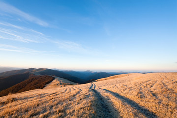 Sunrise autumn mountain road view.