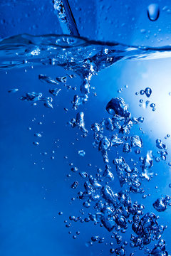 blue beautiful splash of blue water and bubbles with the waves a
