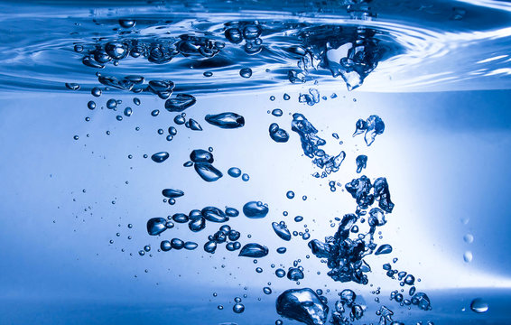 splash of blue water and bubbles with drops