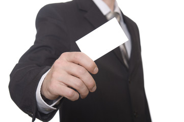 Businessman handing a blank business card over white