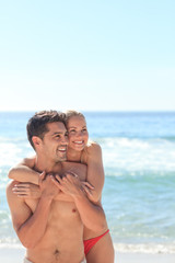 Happy lovers at the beach