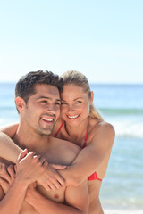 Fototapeta premium Happy lovers at the beach