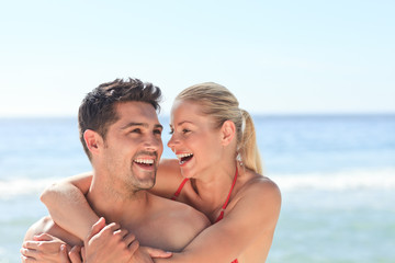 Fototapeta premium Joyful couple at the beach