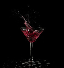 red martini cocktail splashing