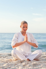 Fototapeta na wymiar Peaceful woman practicing yoga