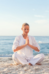 Fototapeta na wymiar Peaceful woman practicing yoga