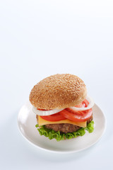 Cheeseburger with tomatoes and lettuce