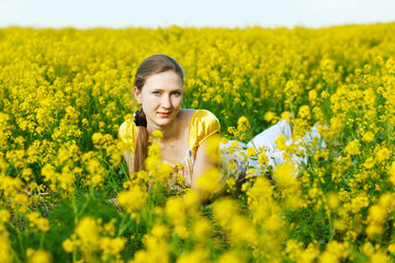 Fototapeta premium happy woman on yellow field