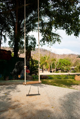 Wood swing in the park.