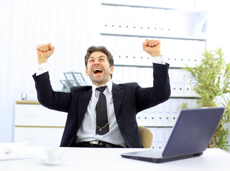 Happy businessman in the office