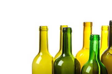 Many empty green wine bottles isolated on white background