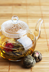 Glass teapot with fresh tea