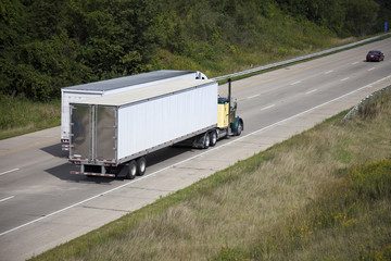 Two semi trucks on the highway