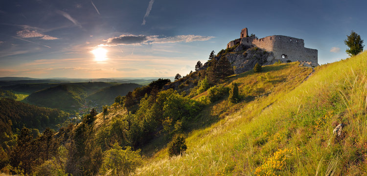 Ruin of castle with sun