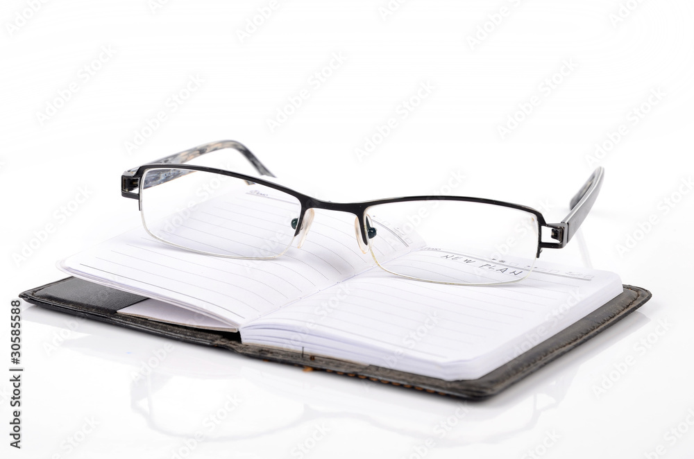 Poster notebook and glasses