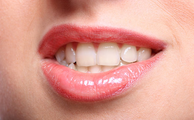 Young woman's glossy lips