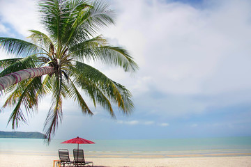 chairs and umbrella on sand beach