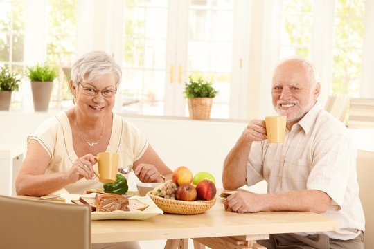 Senior couple having tea at breakfast