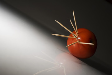 Tomato with toothpicks