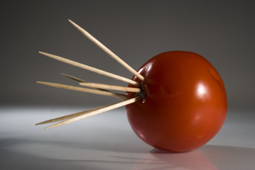 Tomato with toothpicks
