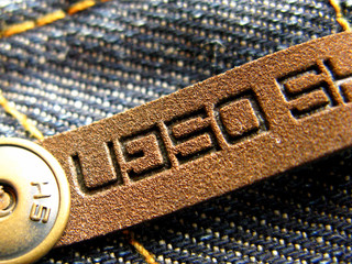 metal button on jeans close up