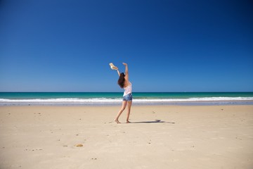 Fototapeta na wymiar happy woman at Zahara beach