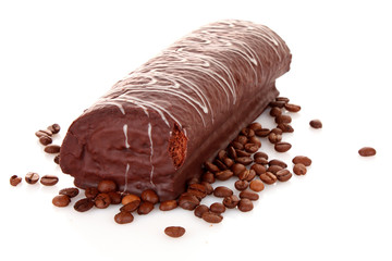 Cake and coffee beans isolated on white