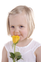 little blond girl with yellow rose