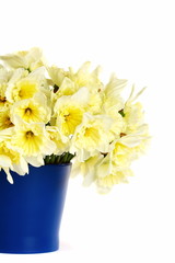 Bouquet in a blue vase on a white background.