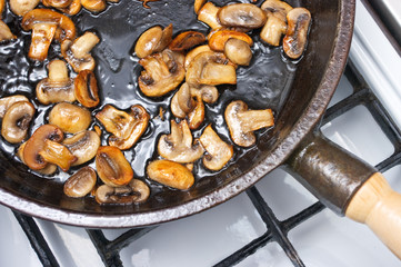 Champignons frying on the pan