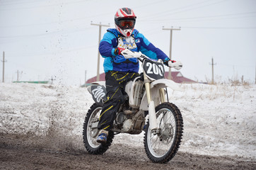 Fototapeta premium Russia, Samara March 6,2011, motocross rider accelerated