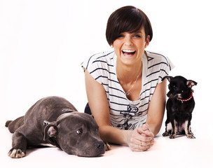 Woman with her dogs chihuahua and English Stafford