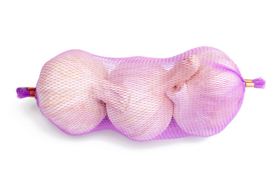 Heads of raw garlic isolated on white background