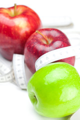 apple and measure tape isolated on white
