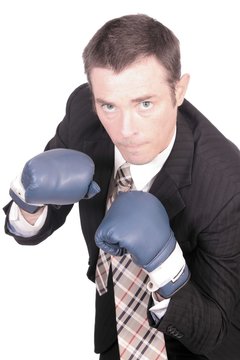 business man boxing punching bag concept image