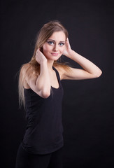 Fototapeta premium Young beauty blond girl in black tank top