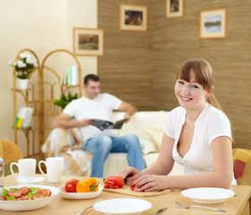 Obraz na płótnie Canvas wife at home in the kitchen