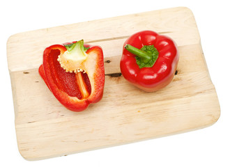 red paprika on wooden board