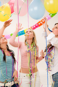 Birthday party celebration - four woman with confetti