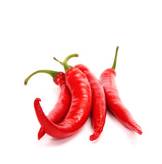 Red hot chili peppers on white background