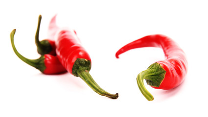 Red hot chili peppers on white background